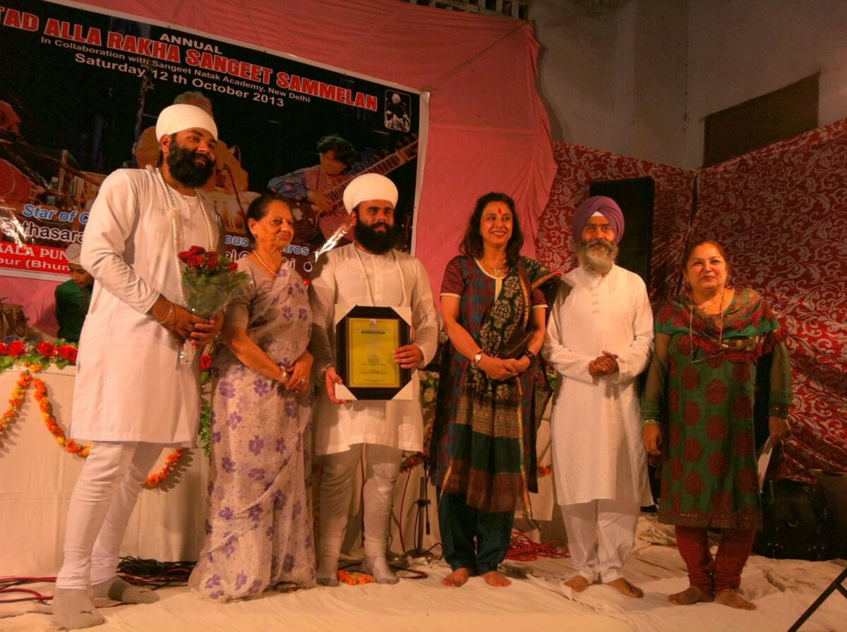 Ustad Kulwinder singh ji & Mrs. Purnima Beri honoured after the amazing Pakhawaj solo concert of ustad allah Rakha khan progran series in Hoshiarpur city Punjab .